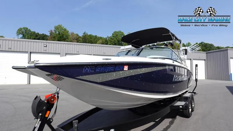 Slide: The Image of 2015 MasterCraft X55 boat on trailer at Race City Marine dealership. - 6
