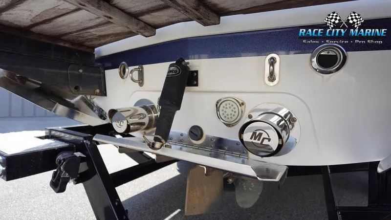 Slide: The Image of 2015 MasterCraft X55 boat rear view with Race City Marine branding. - 9