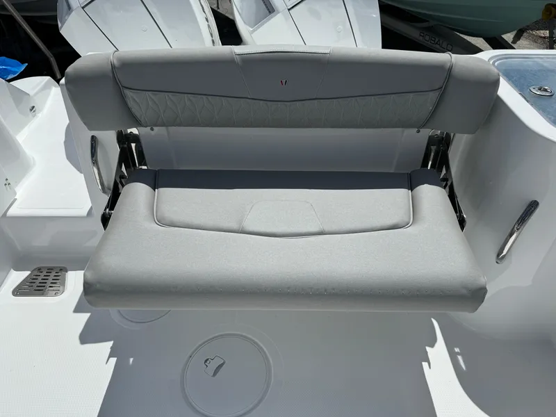 Slide: The Image of 2024 Wellcraft 262 Fisherman boat seat, gray upholstery, sleek design. - 10