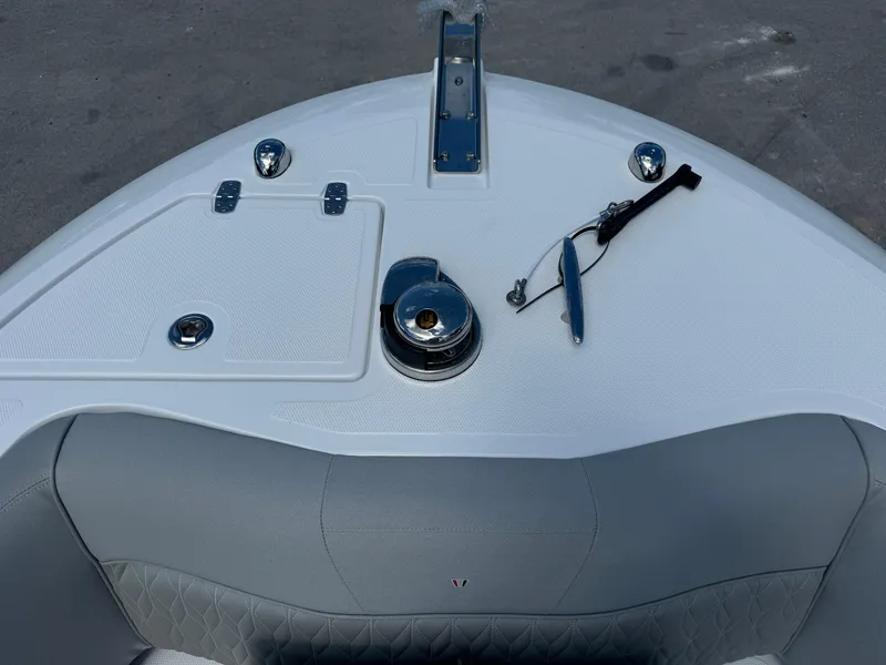 Slide: The Image of 2024 Wellcraft 262 Fisherman boat bow with anchor and seating area. - 18