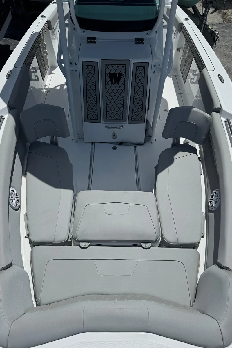 Slide: The Image of 2024 Wellcraft 262 Fisherman boat interior with cushioned seating and modern design. - 24
