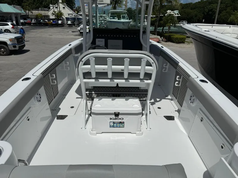 Slide: The Image of 2024 Wellcraft 262 Fisherman boat interior with rod holders and cooler. - 6