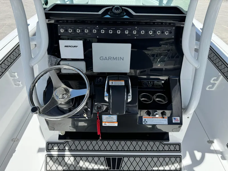Slide: The Image of 2024 Wellcraft 262 Fisherman boat console with Garmin and Mercury controls. - 8