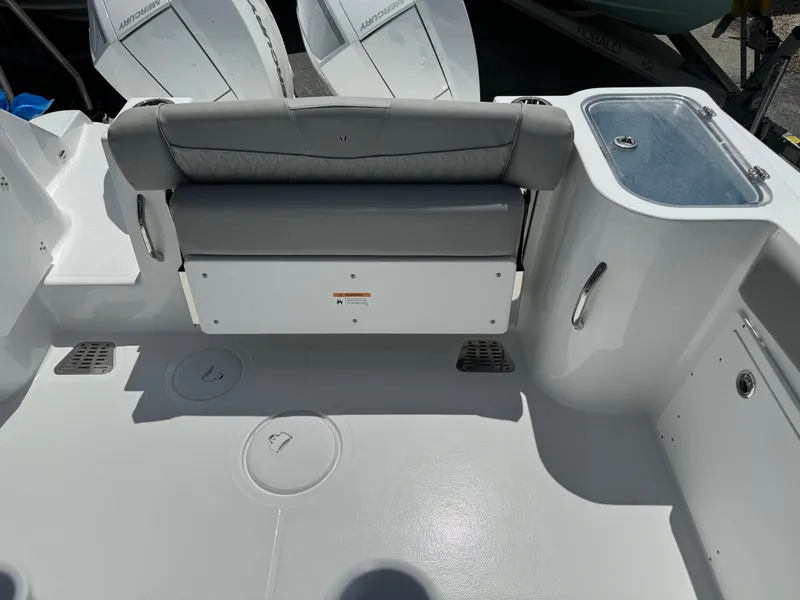 Slide: The Image of 2024 Wellcraft 262 Fisherman boat interior with seating and storage compartments. - 9