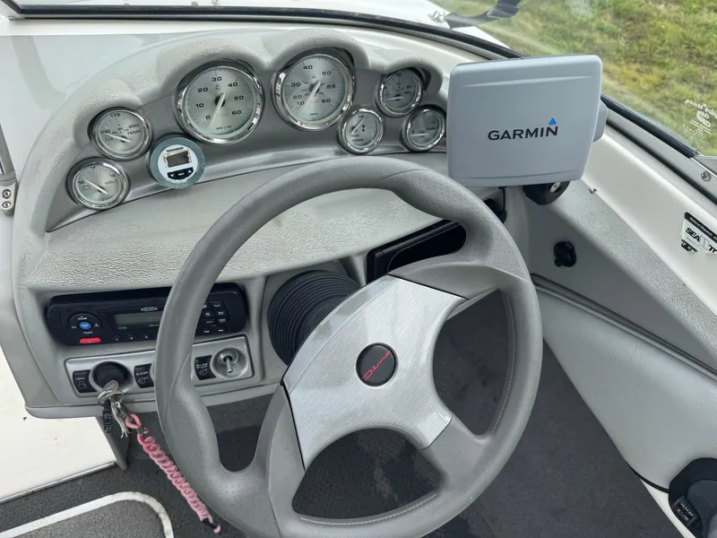 Slide: The Image of Steering wheel and dashboard of 2011 Bayliner 185 boat with Garmin GPS system. - 4