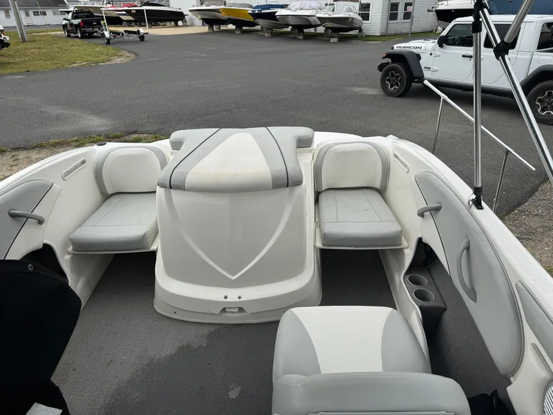 Slide: The Image of 2011 Bayliner 185 boat interior with seating and storage compartments. - 9
