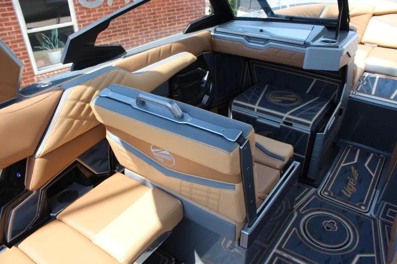 Slide: The Image of Luxurious interior of 2025 Tigé Ultré 23ZX boat with tan and blue seating. - 10