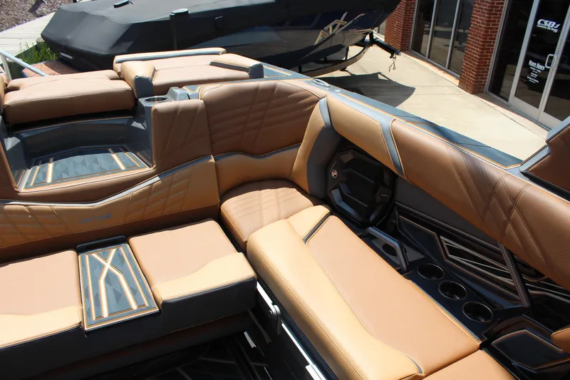 Slide: The Image of Luxurious interior of 2025 Tigé Ultré 23ZX boat with tan leather seating. - 11