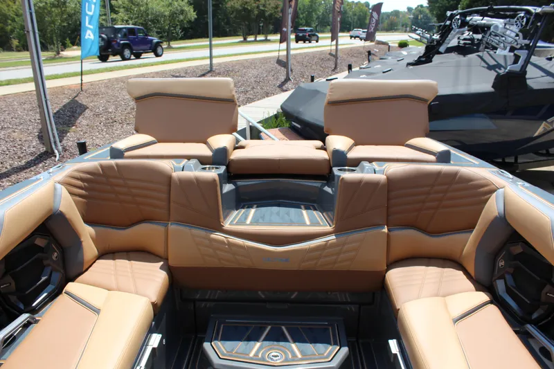 Slide: The Image of 2025 Tigé Ultré 23ZX boat interior with luxurious tan seating. - 13