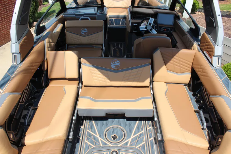 Slide: The Image of Luxurious interior of 2025 Tigé Ultré 23ZX boat with tan leather seating. - 14
