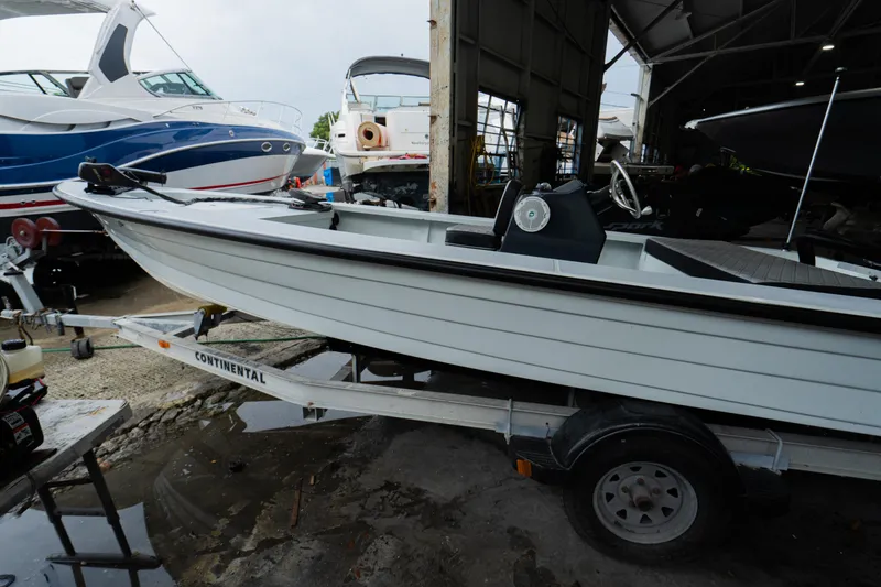 Slide: The Image of 1988 Baretta Success 185 boat on trailer in marina storage. - 5
