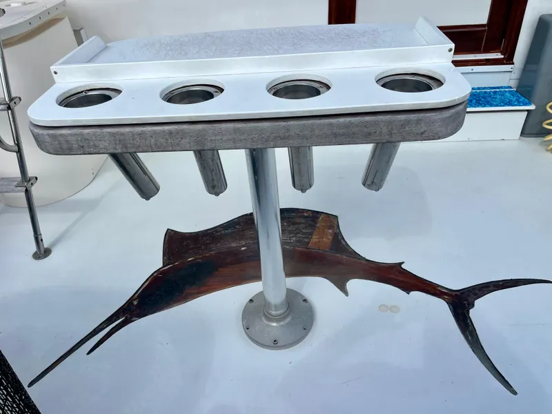 Slide: The Image of Fishing rod holder on 1988 Jersey Dawn 40 boat deck with marlin design. - 10