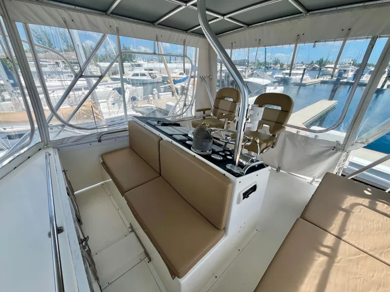 Slide: The Image of Interior of 1988 Jersey Dawn 40 yacht with seating and helm, docked at marina. - 15