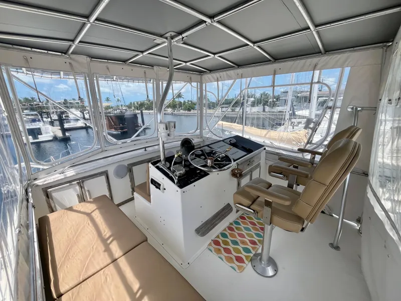 Slide: The Image of Interior helm of 1988 Jersey Dawn 40 yacht with panoramic marina view. - 18
