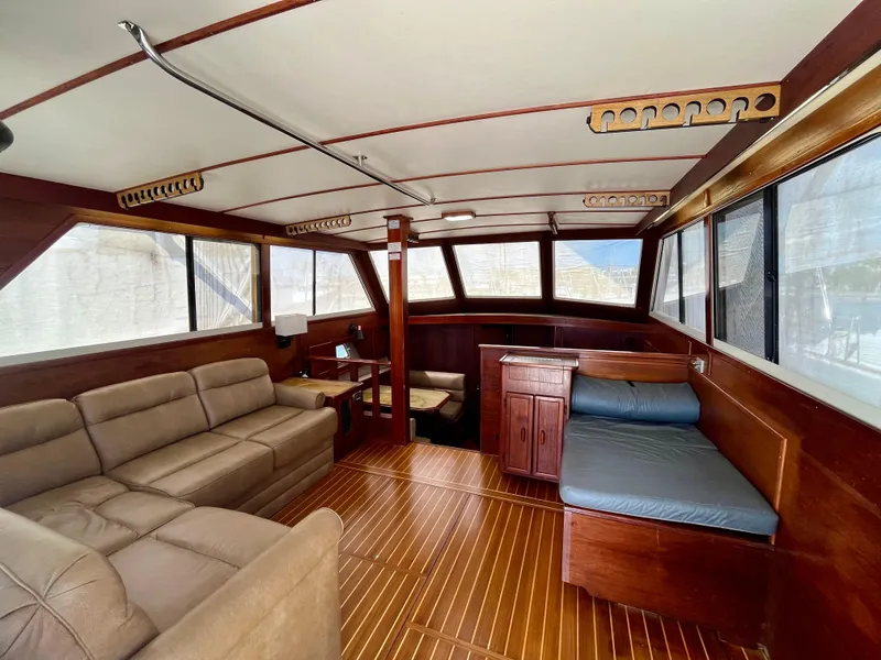 Slide: The Image of Interior of 1988 Jersey Dawn 40 boat with wood paneling and seating. - 20