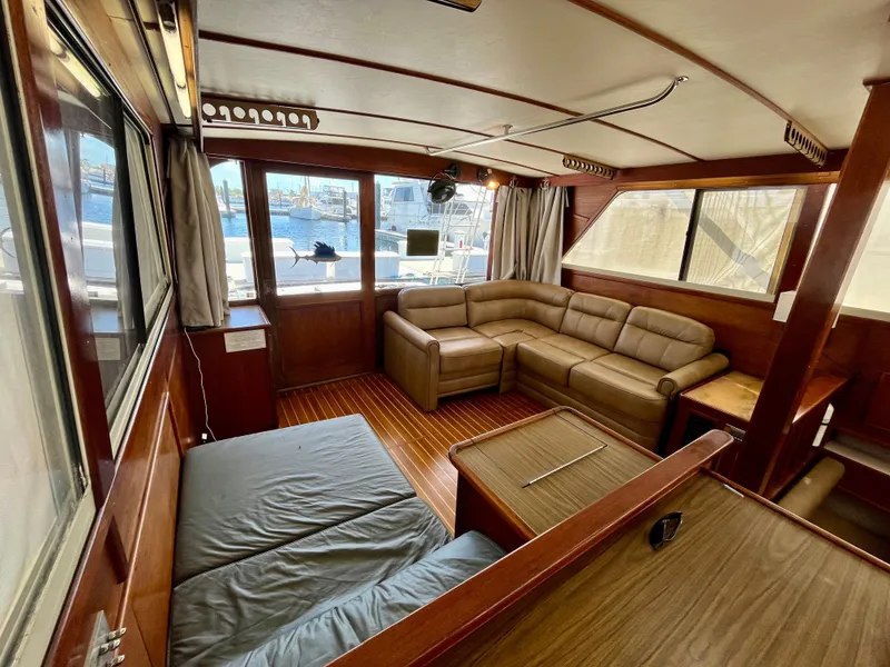 Slide: The Image of Interior of 1988 Jersey Dawn 40 yacht with cozy seating and wood finish. - 21