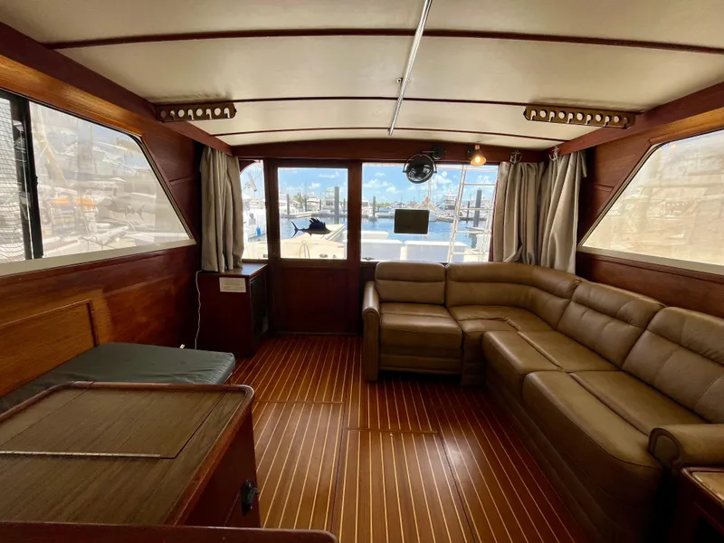Slide: The Image of Interior of 1988 Jersey Dawn 40 yacht with wood paneling and leather seating. - 22