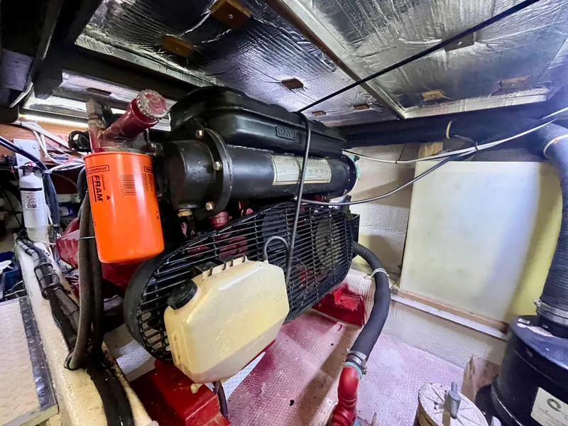 Slide: The Image of Engine room of 1988 Jersey Dawn 40 boat with visible components and wiring. - 36