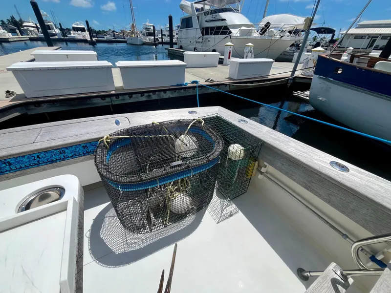 Slide: The Image of Fishing gear on a 1988 Jersey Dawn 40 boat docked at a marina. - 8