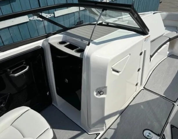 Slide: The Image of 2025 Yamaha Boats AR250 interior with seating and storage compartments. - 10