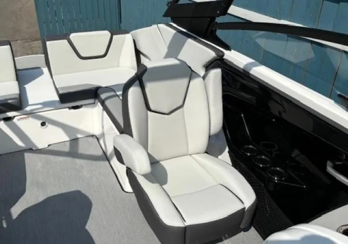 Slide: The Image of 2025 Yamaha Boats AR250 interior with modern seating and sleek design. - 12
