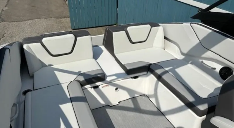 Slide: The Image of 2025 Yamaha Boats AR250 interior seating with modern design and comfortable upholstery. - 13