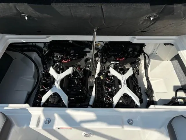 Slide: The Image of 2025 Yamaha Boats AR250 engine compartment with dual engines and white cross braces. - 15