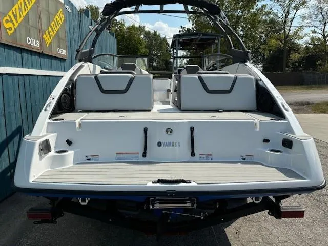 Slide: The Image of 2025 Yamaha Boats AR250, rear view, showcasing spacious seating and sleek design. - 4