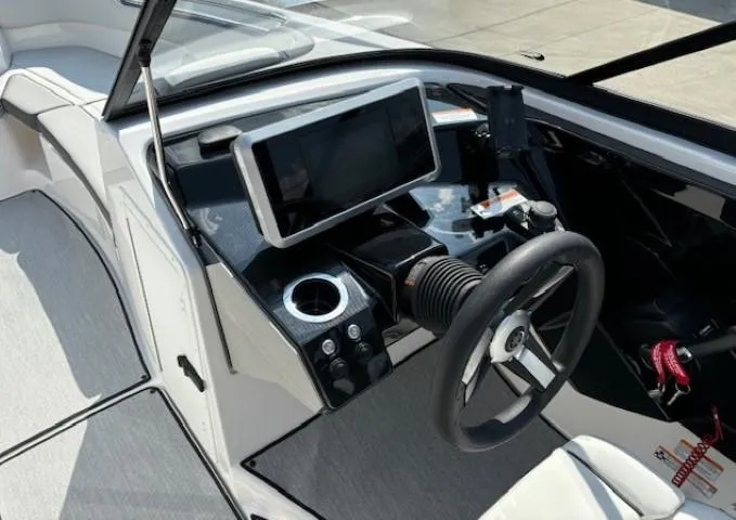 Slide: The Image of 2025 Yamaha Boats AR250 dashboard with steering wheel and touchscreen display. - 8