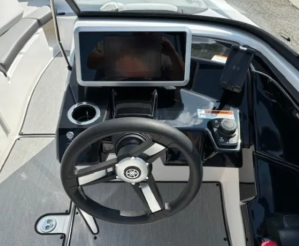 Slide: The Image of 2025 Yamaha Boats AR250 dashboard with steering wheel and touchscreen display. - 9