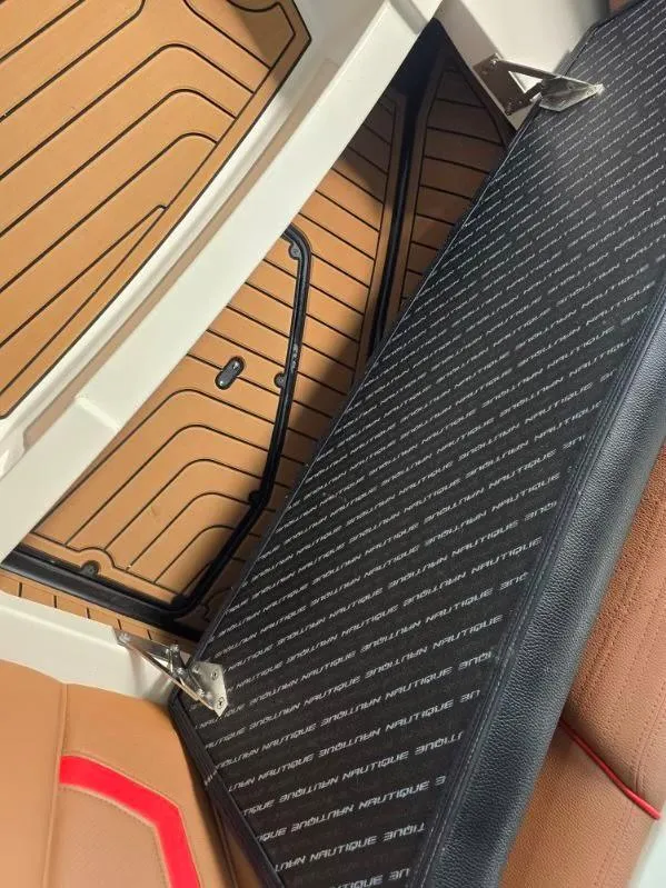 Slide: The Image of 2019 Nautique Super Air Nautique G25 interior with custom flooring and seating. - 14
