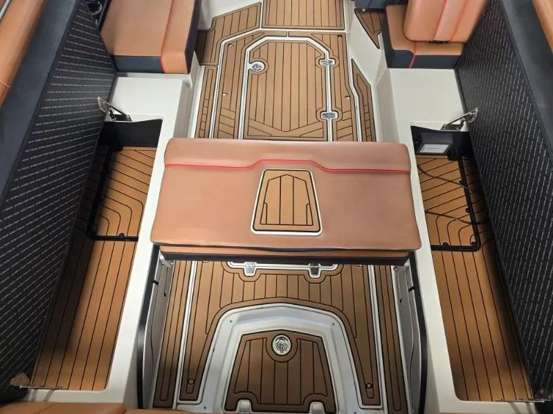 Slide: The Image of 2019 Nautique Super Air Nautique G25 interior with stylish seating and teak-style flooring. - 21