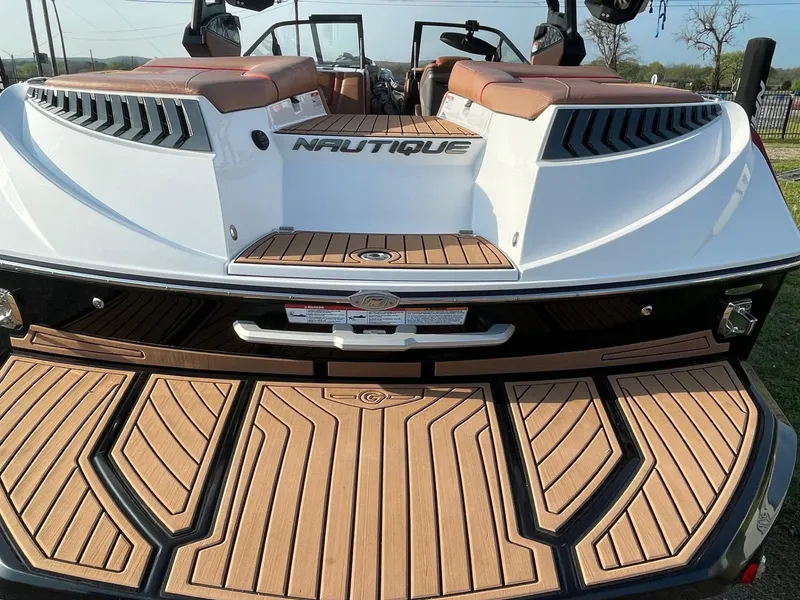 Slide: The Image of 2019 Nautique Super Air Nautique G25 boat with teak deck and luxurious seating. - 4
