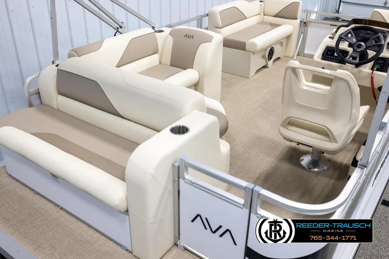 Slide: The Image of 2025 Avalon VEN CRB pontoon boat interior with beige seating and steering console. - 12