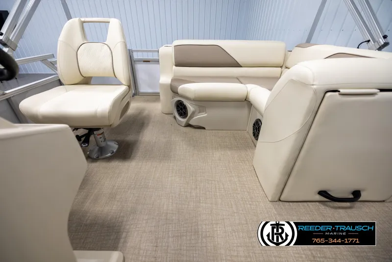 Slide: The Image of 2025 Avalon VEN CRB boat interior with beige seating and carpet flooring. - 14
