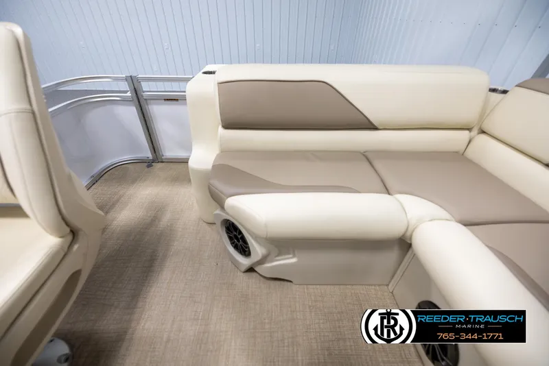 Slide: The Image of 2025 Avalon VEN CRB boat interior with beige seating and speaker. - 15