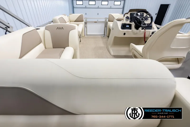 Slide: The Image of 2025 Avalon VEN CRB boat interior with beige seating and modern helm. - 16