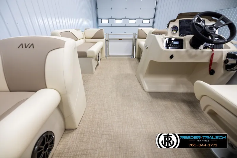 Slide: The Image of 2025 Avalon VEN CRB boat interior with beige seating and modern dashboard. - 17