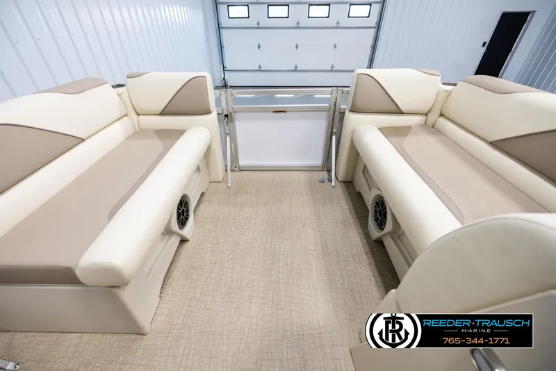 Slide: The Image of 2025 Avalon VEN CRB boat interior with beige seating and carpet flooring. - 18