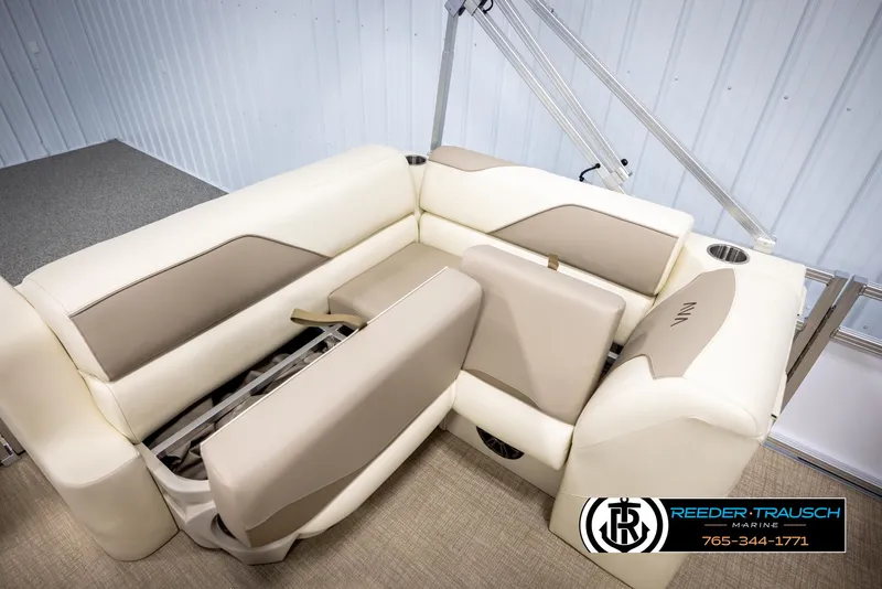 Slide: The Image of 2025 Avalon VEN CRB boat seating with beige and cream upholstery, featuring storage compartments. - 23