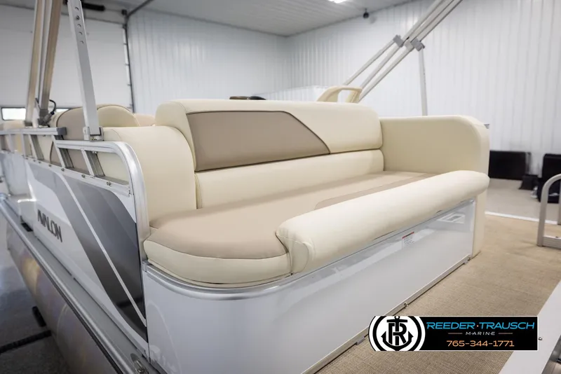 Slide: The Image of 2025 Avalon VEN CRB boat interior with beige seating in a showroom. - 24
