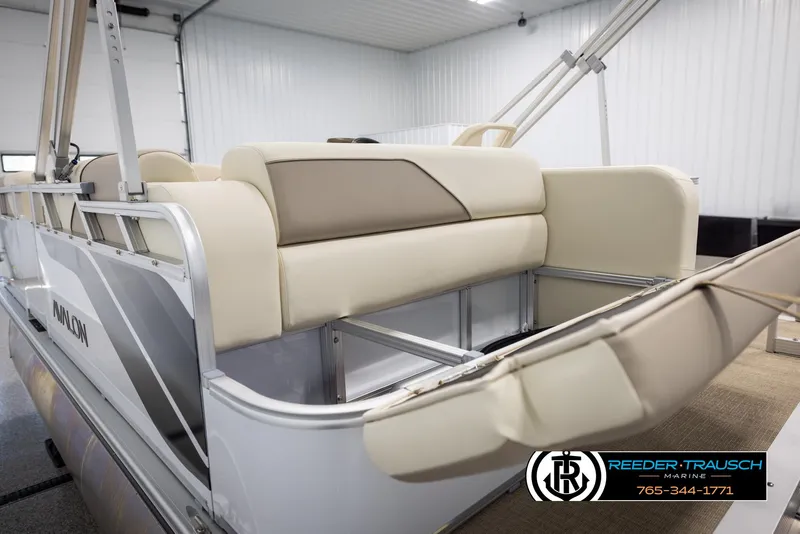 Slide: The Image of Avalon VEN CRB 2025 pontoon boat interior with beige seating in a showroom. - 25