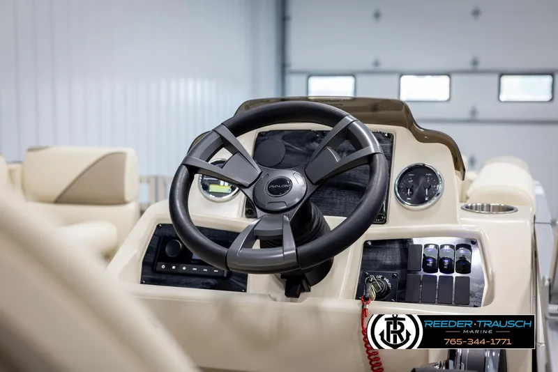 Slide: The Image of 2025 Avalon VEN CRB boat dashboard with steering wheel and controls. - 26