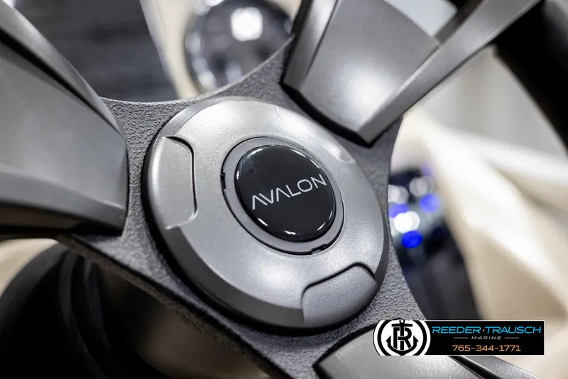 Slide: The Image of Close-up of 2025 Avalon VEN CRB steering wheel with logo. - 28