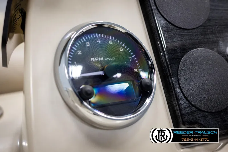Slide: The Image of Close-up of 2025 Avalon VEN CRB RPM gauge with Reeder-Trausch Marine logo. - 30