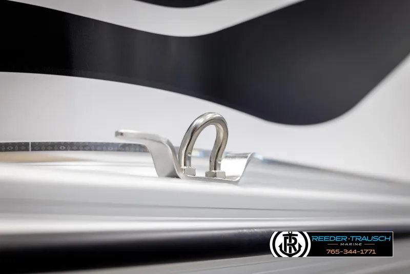 Slide: The Image of Close-up of 2025 Avalon VEN CRB boat detail with Reeder-Trausch Marine logo. - 44