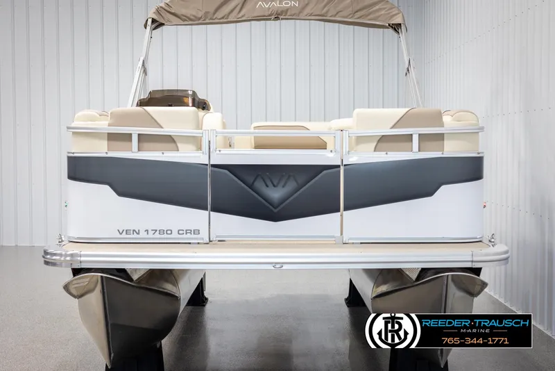 Slide: The Image of 2025 Avalon VEN CRB pontoon boat in showroom, rear view. - 8