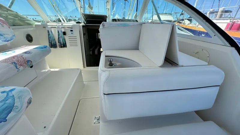 Slide: The Image of 2003 Tiara Yachts 2900 Coronet interior with white seating and compact sink. - 12