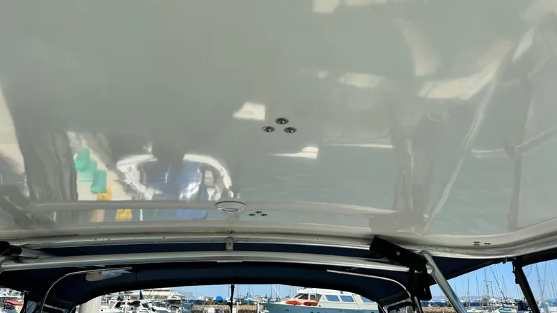 Slide: The Image of 2003 Tiara Yachts 2900 Coronet boat interior with marina view. - 13