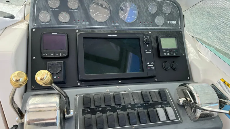 Slide: The Image of Dashboard of a 2003 Tiara Yachts 2900 Coronet with navigation instruments and controls. - 14